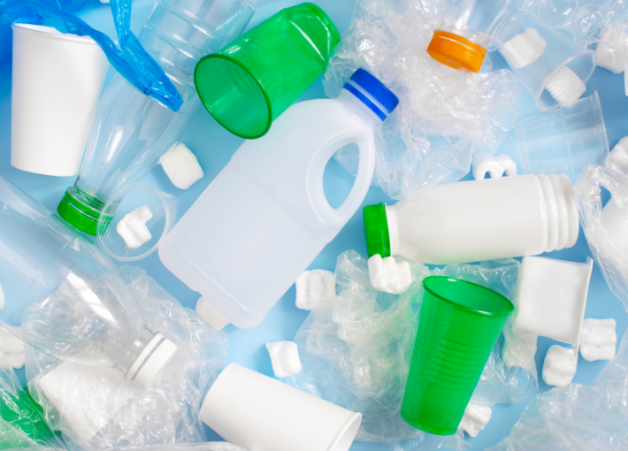 White and Green plastic bottles and cups